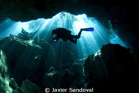 Cave diver doing deco stop in cenote chac mool by Javier Sandoval 