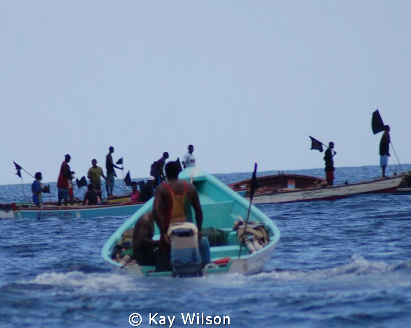 Fishing community funeral procession. by Kay Wilson 