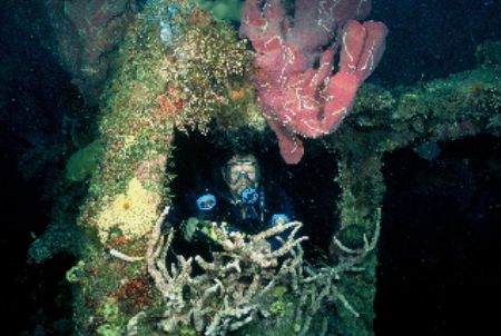 Bruce in the wheelhouse of a shipwreck in Pavuvu Chnl. So... by Shane Clancy 