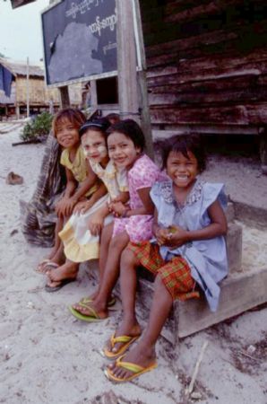 Between dives,burma, sea gypsies kids on school steps. by Allen Ayling 