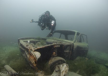 Mark with car wreck. D200, 10.5mm. by Derek Haslam 