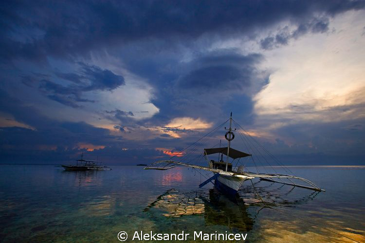 Sunset on Moalboal by Aleksandr Marinicev 