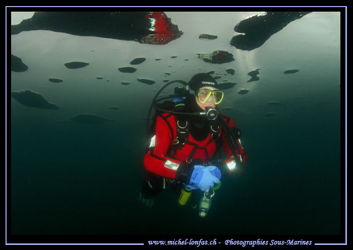 Having fun under the Ice... My friend Stéphane in a small... by Michel Lonfat 