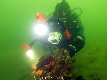 My budy Frans taking pictures of Cyclopterus lumpus. I wa... by John De Jong 