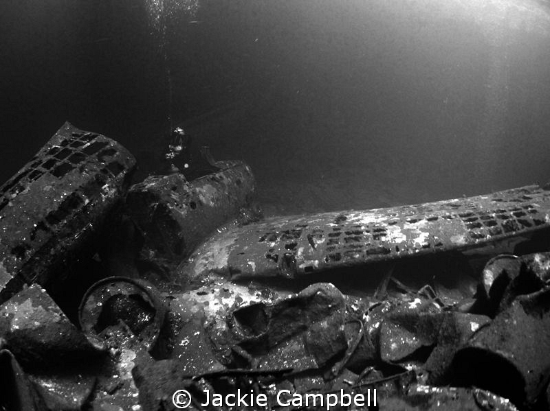 Zeros in the cargo hold of the Fujikawa Maru.
Natural li... by Jackie Campbell 