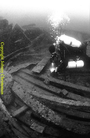 Going thru the debris, Michael is on a tresure hunt for s... by Johnny Christensen 