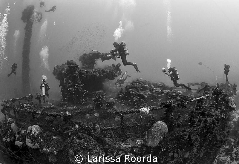 A busy afternoon at the Unkai Maru, Truk Lagoon. by Larissa Roorda 