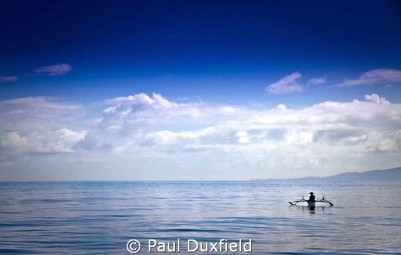 Calm and tranquility, as this lone fisherman waits patien... by Paul Duxfield 