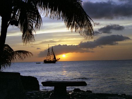 I took this shot of the sun setting from behind the Carib... by Robyn Churchill 