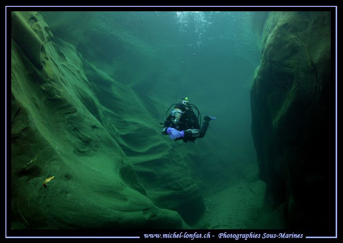 River diving. My wife Caroline going up the Verzasca... Q... by Michel Lonfat 