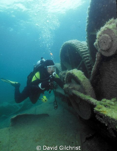 Diver examines equipment on the vessel Michigan, in Georg... by David Gilchrist 