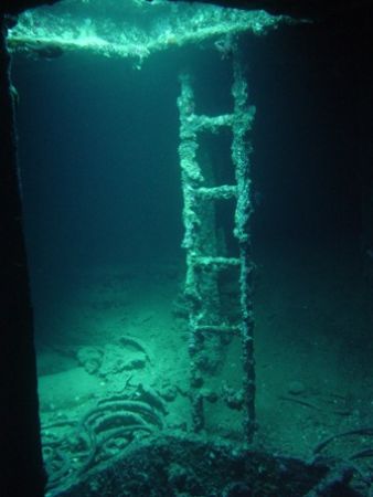 Picture is taken inside the bow of the Thistlegorm in Egypt. by Jj Waanders 