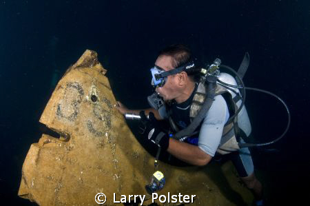 Tail section of Japanese Zero in the hold of sunken freig... by Larry Polster 