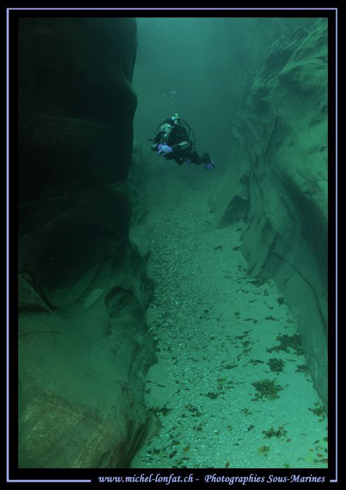 My Wife Caroline exploring the walls of the Verzasca Rive... by Michel Lonfat 