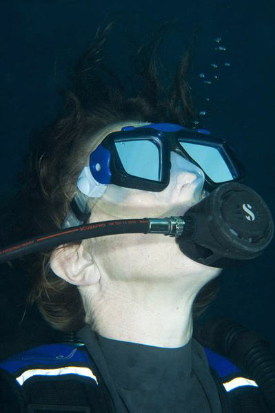 Close up of dive buddy on final ascent from a Red Sea div... by Paul Colley 
