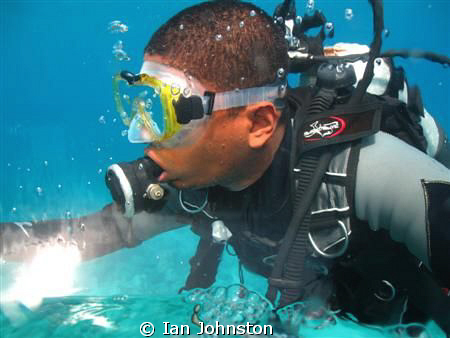 Dive guide taken from inside a personal minisub in Maurit... by Ian Johnston 