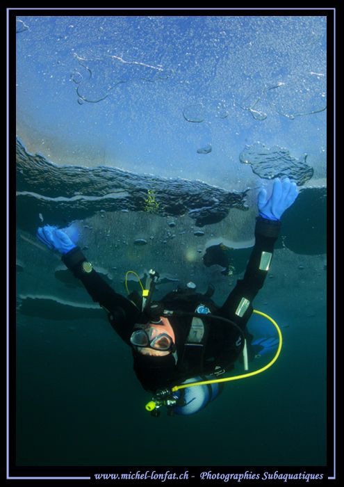 Having fun under the ice... :O)... by Michel Lonfat 