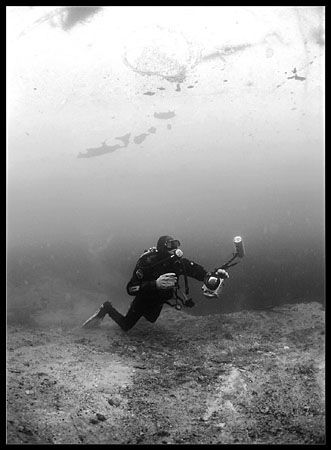 Alex under the ice, in a fresh water lake i Vagnhärad, so... by Magnus Keijser 
