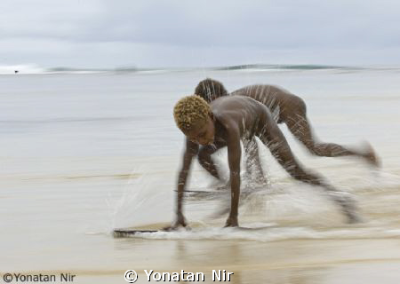 Kids playing in paradise by Yonatan Nir 
