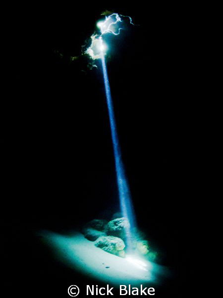 A single beam of sunlight pierces the darkness of the Jac... by Nick Blake 