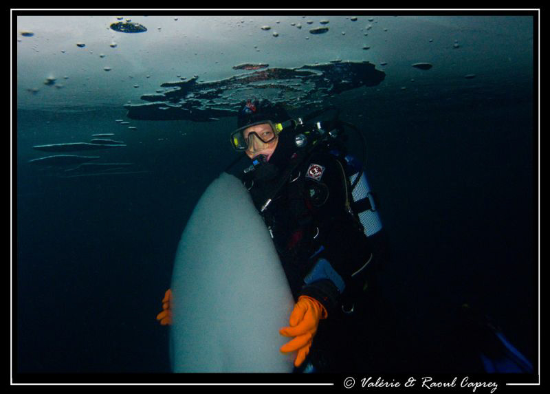 My friend JP is holding an ice-block that covers the hole... by Raoul Caprez 