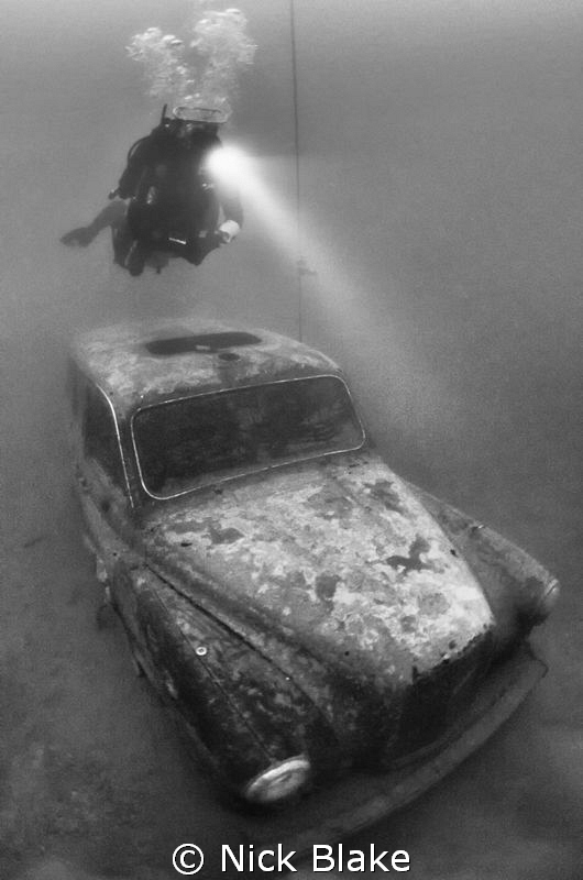London Taxi Cab and diver, Wraysbury Lake, Middlesex by Nick Blake 
