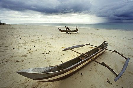 Comores-Islands/outrigger and fishermen on 
Grande Comor... by Manfred Bail 