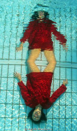 Red reflection in the pool by Adolfo Maciocco 