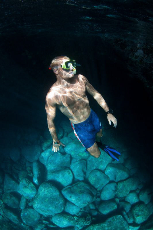 Natural light image of a snorkeler diving in the South At... by Paul Colley 