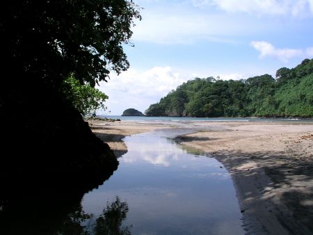 Freshwater river coming out of the mountains on the islan... by Charlie Foreman 