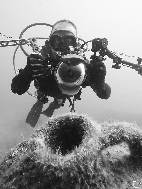 UW photographer v/s ancient amphora ;-) B/W shot with nat... by Rico Besserdich 