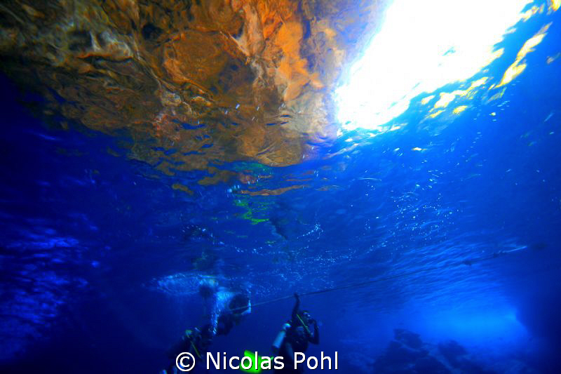 A Nice Golden Sunset glowing the Cave Rocks above the Sur... by Nicolas Pohl 