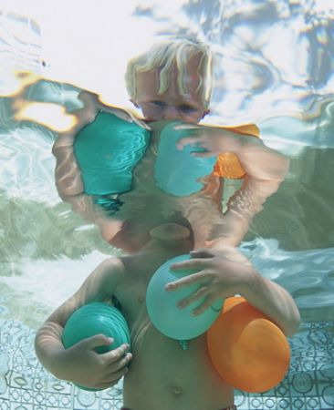 my son playing in the pool at home.nikon f100 with 17-35m... by Gregory Grant 