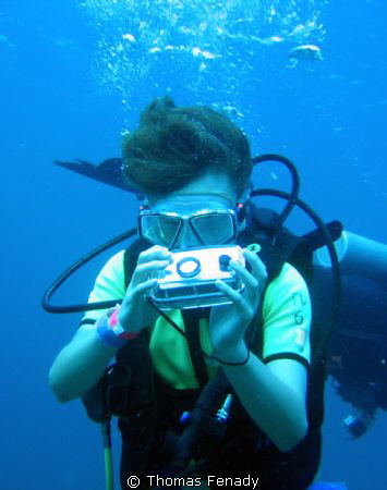 Picture of my son playing with my old UW camera by Thomas Fenady 