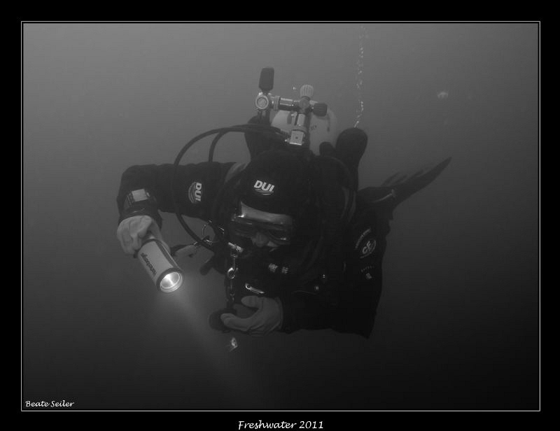 My Buddy watching the super small  frechwater jelly fish by Beate Seiler 