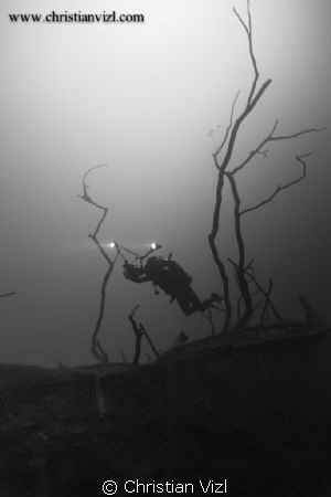 Cavern Diver entering a sulfur layer at 120 feet inside C... by Christian Vizl 