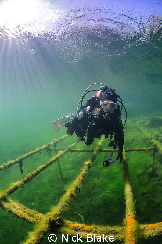 Diver and Sun Rays, Wraysbury Lake, Middlesex. by Nick Blake 