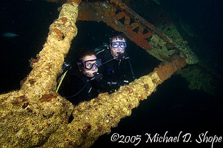 Divers pose on bridge span #14 in Panama City Beach Flori... by Michael Shope 