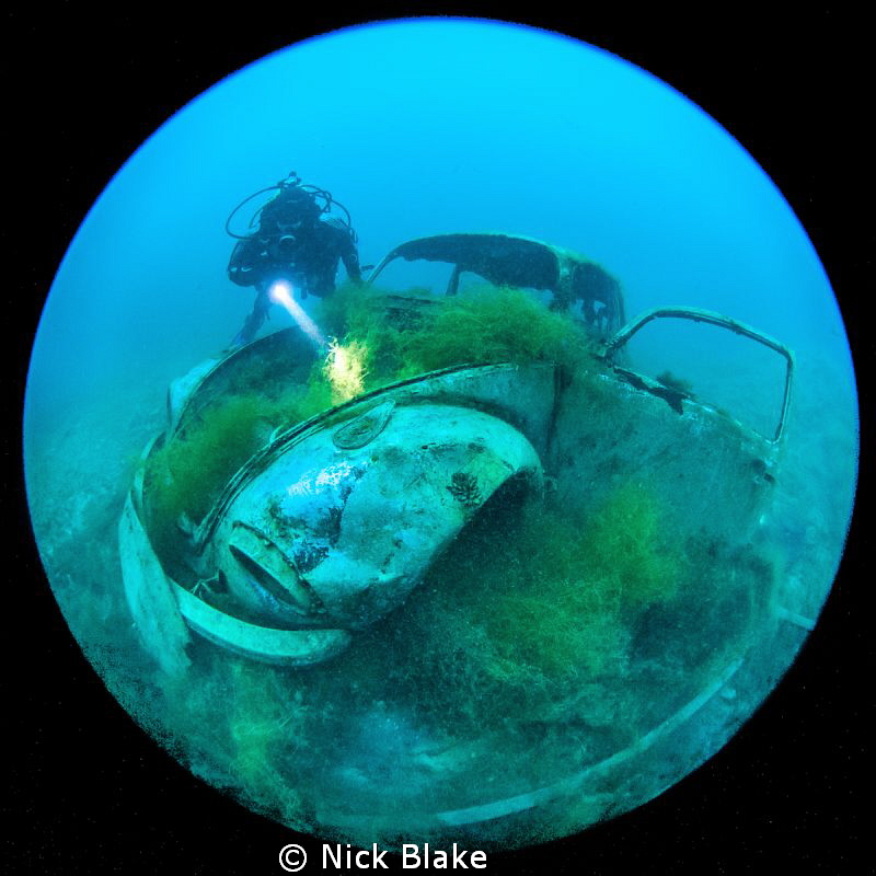 VW Beetle and diver at Capernwray by Nick Blake 