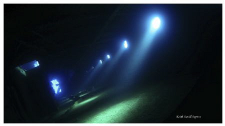 Light streaming in through the portholes of the Giannis D... by Keith Savill 