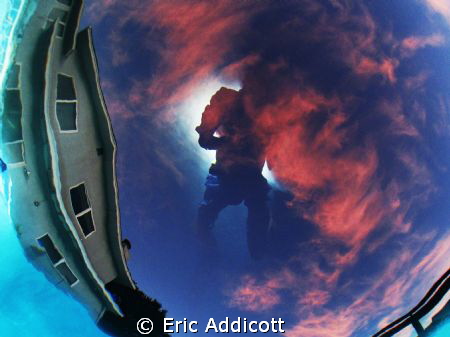 Bottom of pool sunset with surface reflection of photogra... by Eric Addicott 