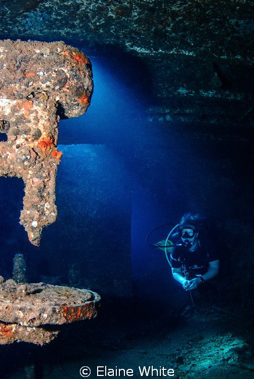 Diver and pillar drill, in tool room Christoula K by Elaine White 