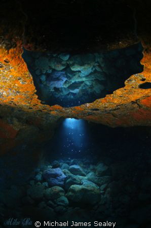 A RAY OF LIGHT. The sun has found it's way through the ro... by Michael James Sealey 