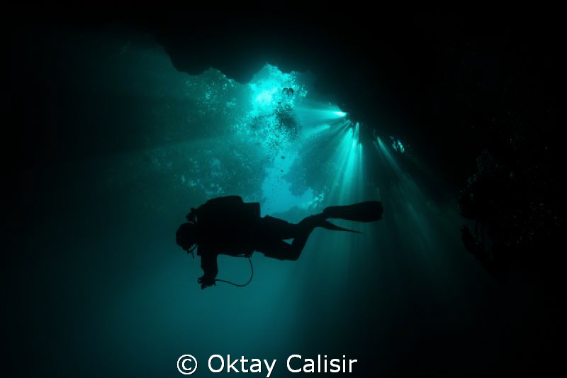 Silhouette of Cave Diver in Mexico - Cenotes by Oktay Calisir 