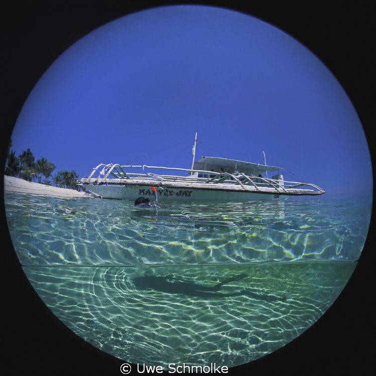 Bangka and shadow.
Image is taken with a 8mm circular Fi... by Uwe Schmolke 