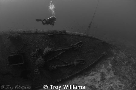Diver heading for the ascent line on the USS Emmons @ 120ft. by Troy Williams 