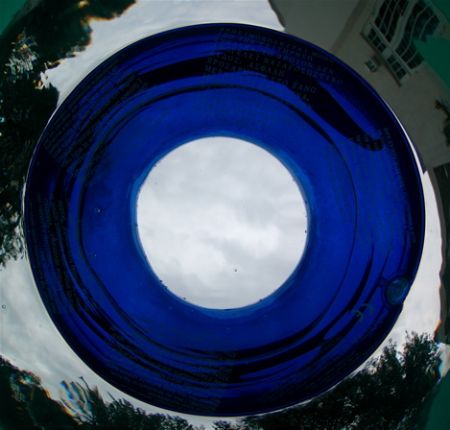 testing camera in pool , childs floatation ring by Gregory Grant 