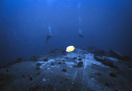 Larry and Alisa on up side down LCU off Hawaii Kai, Oahu,... by Robert Fleckenstein 
