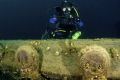 Diver poses at a set of Deadeyes on the Barque 'Arabia', Fathom Five National Marine Park, Tobermory, Ontario 