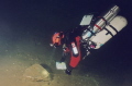 Side-mount diver mapping out the tunnel system of a flooded mine. Nikonos V with 15mm lens, twin Ikelite 150 strobes and Kodak ASA 400 film. Colour corrected in PS. 